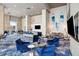 Large lounge area with TV, seating, and serving area at 4561 Olde Perimeter Way # 806, Dunwoody, GA 30346