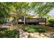 Spacious backyard featuring a deck and a covered patio, perfect for outdoor relaxation and entertaining at 1100 Tuxedo Dr, Roswell, GA 30075