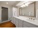 Bright bathroom features modern fixtures, a glass-enclosed shower, and ample counter space at 1100 Tuxedo Dr, Roswell, GA 30075