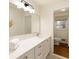 Bright bathroom showcasing a modern vanity with a large mirror and classic fixtures at 1100 Tuxedo Dr, Roswell, GA 30075