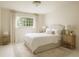 Cozy bedroom with neutral tones, soft carpet, and window that allows natural light at 1100 Tuxedo Dr, Roswell, GA 30075