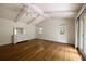 Bright bedroom with hardwood floors, exposed beams and a walk-out to deck at 1100 Tuxedo Dr, Roswell, GA 30075