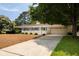 Spacious driveway leading to a well-maintained home with a two-car garage at 1100 Tuxedo Dr, Roswell, GA 30075