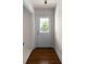 Bright entryway with hardwood floors, a glass-paneled door, and fresh white trim at 1100 Tuxedo Dr, Roswell, GA 30075