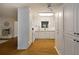 Well-lit kitchen boasts custom white cabinets, modern appliances, and hardwood floors at 1100 Tuxedo Dr, Roswell, GA 30075