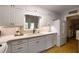 Updated kitchen features white cabinets, modern appliances, and ample counter space at 1100 Tuxedo Dr, Roswell, GA 30075