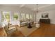 Spacious living room with large windows and views of the lush exterior at 1100 Tuxedo Dr, Roswell, GA 30075