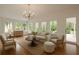 Bright living room filled with lots of windows and beautiful hardwood floors at 1100 Tuxedo Dr, Roswell, GA 30075