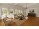 Spacious living room with hardwood floors, neutral decor, and many windows offering natural light at 1100 Tuxedo Dr, Roswell, GA 30075