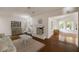 Cozy living room with hardwood floors, fireplace and views of the backyard at 1100 Tuxedo Dr, Roswell, GA 30075