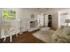 Bright living room features a white brick fireplace, hardwood floors, and a view to an open area at 1100 Tuxedo Dr, Roswell, GA 30075