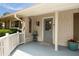 Cozy front porch features a 'Welcome' sign, plants, and a painted blue floor at 1100 Tuxedo Dr, Roswell, GA 30075
