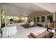 Spacious porch with multiple seating areas perfect for entertaining guests at 1100 Tuxedo Dr, Roswell, GA 30075