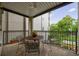 Cozy outdoor balcony with wrought iron railing featuring a table and chairs, perfect for relaxing at 50 Biscayne Nw Dr # 4110, Atlanta, GA 30309