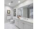 Well-lit bathroom with double vanity, large mirror, and white cabinetry providing ample storage and functionality at 50 Biscayne Nw Dr # 4110, Atlanta, GA 30309