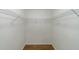 Walk in closet with hardwood flooring and built in wire shelving, providing ample storage space at 50 Biscayne Nw Dr # 4110, Atlanta, GA 30309
