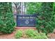 The Manor House Condominium sign with lush landscaping at 50 Biscayne Nw Dr # 4110, Atlanta, GA 30309