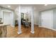 Elegant dining room with decorative pillars, hardwood floors, a modern chandelier, and neutral tones at 50 Biscayne Nw Dr # 4110, Atlanta, GA 30309