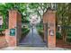 Secure entrance gate with brick pillars, providing privacy and exclusivity at 50 Biscayne Nw Dr # 4110, Atlanta, GA 30309
