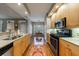 Modern kitchen featuring stainless steel appliances, granite countertops, and open to the dining area at 50 Biscayne Nw Dr # 4110, Atlanta, GA 30309