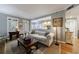 Open-concept living room with hardwood floors, a comfortable sofa, and a view into the adjacent kitchen at 50 Biscayne Nw Dr # 4110, Atlanta, GA 30309