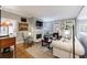 Bright living room with a fireplace, large window, hardwood floors, and a neutral color palette at 50 Biscayne Nw Dr # 4110, Atlanta, GA 30309
