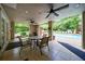 Inviting covered patio area with seating, overlooking the community pool at 50 Biscayne Nw Dr # 4110, Atlanta, GA 30309