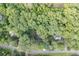 An aerial view shows the property, highlighting its location among dense trees and surrounding streets at 5930 Bridle Dr, Cumming, GA 30028