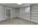 Finished basement with vinyl flooring and custom shelving at 5930 Bridle Dr, Cumming, GA 30028