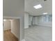 Open basement area with luxury vinyl plank floors and a walkout door at 5930 Bridle Dr, Cumming, GA 30028