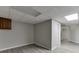 Spacious basement features modern vinyl floors and a drop ceiling with recessed lighting at 5930 Bridle Dr, Cumming, GA 30028