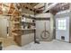 Basement storage area with built-in shelving, peg board, and access to the exterior at 5930 Bridle Dr, Cumming, GA 30028