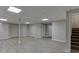 Spacious finished basement with gray vinyl floors at 5930 Bridle Dr, Cumming, GA 30028