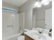Bathroom featuring a shower/tub combination, a modern vanity, and neutral fixtures at 5930 Bridle Dr, Cumming, GA 30028