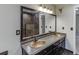 Bathroom featuring a granite countertop and double sink vanity with an oversized mirror at 5930 Bridle Dr, Cumming, GA 30028