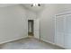 This bedroom features plush carpet and closet space at 5930 Bridle Dr, Cumming, GA 30028