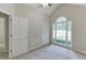 Bedroom featuring vaulted ceiling, carpet, a closet, and a large window for natural light at 5930 Bridle Dr, Cumming, GA 30028