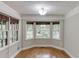 Breakfast nook with bay windows offering ample natural light and hardwood flooring at 5930 Bridle Dr, Cumming, GA 30028