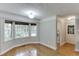 Breakfast nook with bay windows, hardwood floors, and access to laundry room at 5930 Bridle Dr, Cumming, GA 30028