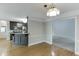 Dining area with hardwood floors open to the kitchen and living room at 5930 Bridle Dr, Cumming, GA 30028