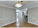 Dining area with hardwood floors offering easy access to kitchen and laundry at 5930 Bridle Dr, Cumming, GA 30028