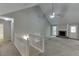 Bright living room with high ceilings, a stone fireplace, neutral paint, and plush carpeting at 5930 Bridle Dr, Cumming, GA 30028