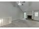 Bright living room featuring a fireplace, vaulted ceilings, and ample natural light at 5930 Bridle Dr, Cumming, GA 30028
