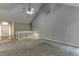 Spacious living area with vaulted ceilings, fireplace, and staircase at 5930 Bridle Dr, Cumming, GA 30028