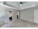 This main bedroom features an ensuite bathroom and carpeted floors at 5930 Bridle Dr, Cumming, GA 30028