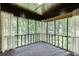 Screened-in porch overlooking a private wooded backyard at 5930 Bridle Dr, Cumming, GA 30028
