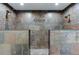 This bathroom features two shower spaces with natural stone at 5930 Bridle Dr, Cumming, GA 30028