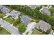 A high altitude view of the home with an extended driveway in a neighborhood with mature trees at 1565 Briergate Dr, Duluth, GA 30097