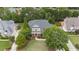 A high altitude view of the home with an extended driveway in a neighborhood with mature trees and lawns at 1565 Briergate Dr, Duluth, GA 30097