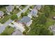 Aerial view of home featuring a large deck, lush landscaping, and mature trees at 1565 Briergate Dr, Duluth, GA 30097